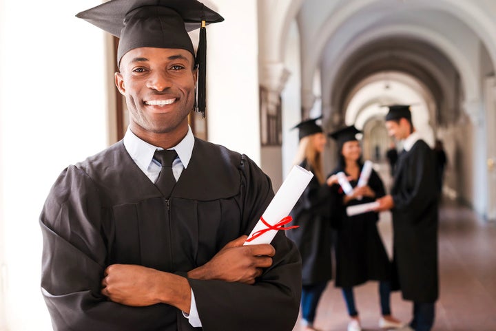 college graduate holding his diploma | Subaru World of Newton in Newton NJ
