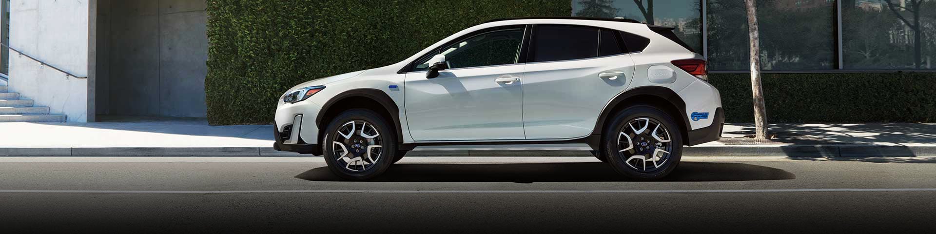 The side profile of a white Subaru Crosstrek Hybrid | Subaru World of Newton in Newton NJ