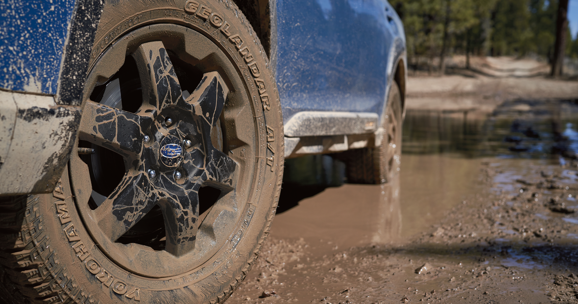 A close-up of the 17-inch off-road wheels and all-terrain Yokohama GEOLANDAR® tires on the 2023 Outback Wilderness. | Subaru World of Newton in Newton NJ