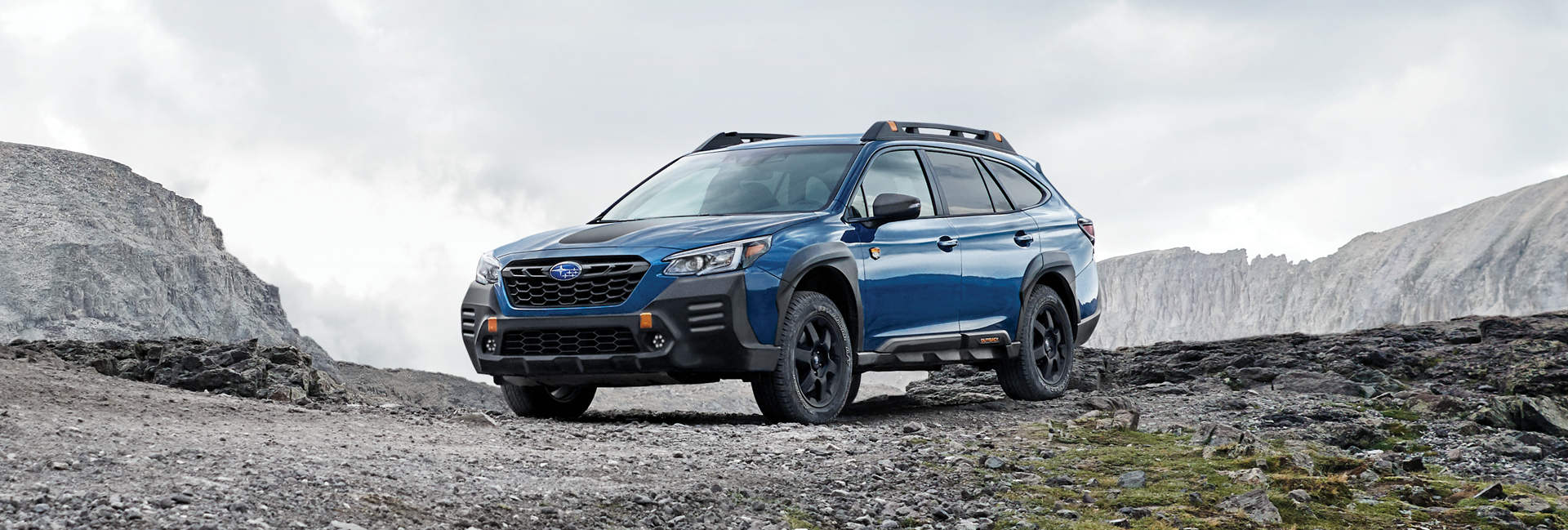 A 2023 Outback Wilderness parked in the mountains. | Subaru World of Newton in Newton NJ